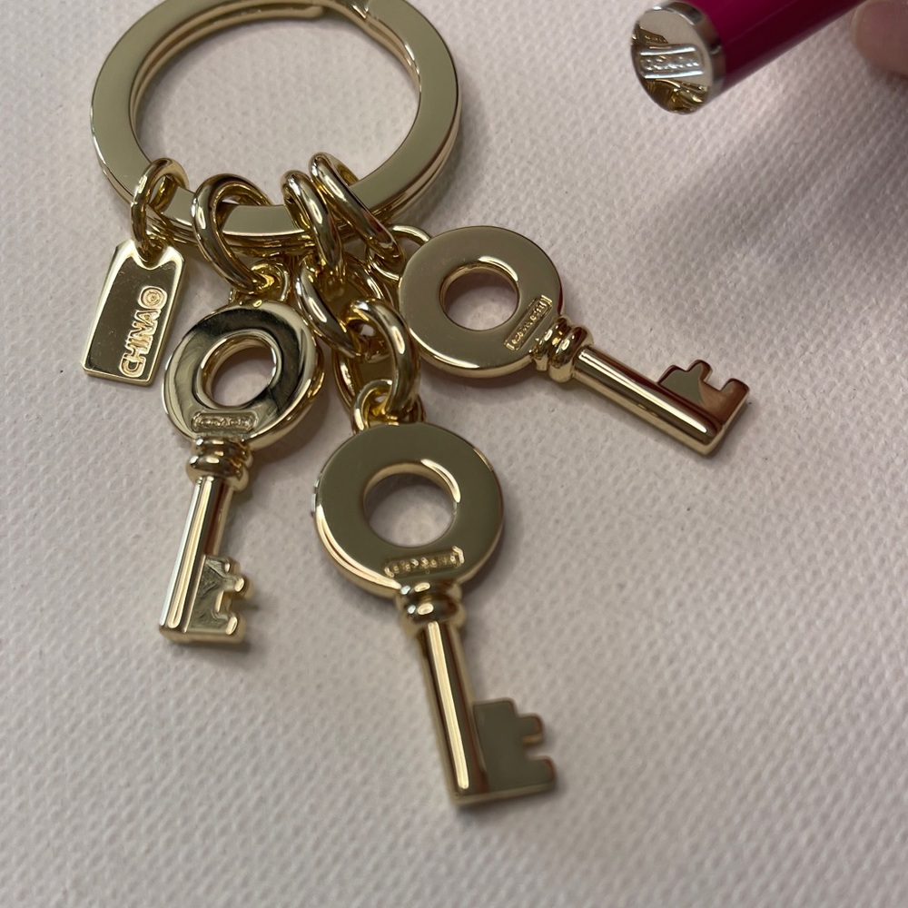 Gold Coach Keychain with Colorful Keys and a Pink Coach Pen - Picture 4 of 5